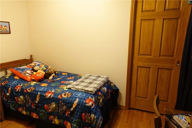 bedroom with light wood-type flooring