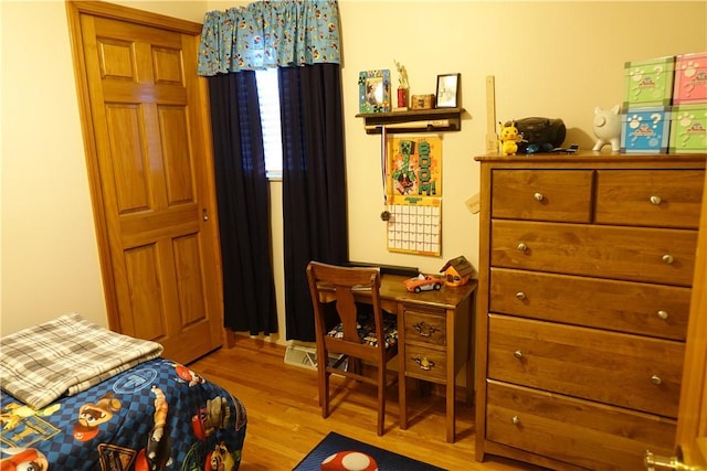 bedroom featuring light hardwood / wood-style floors