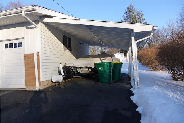 view of vehicle parking with a garage and a carport