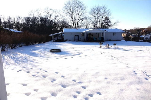 view of yard covered in snow