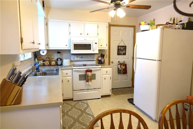 kitchen with ceiling fan, white cabinets, sink, and white appliances