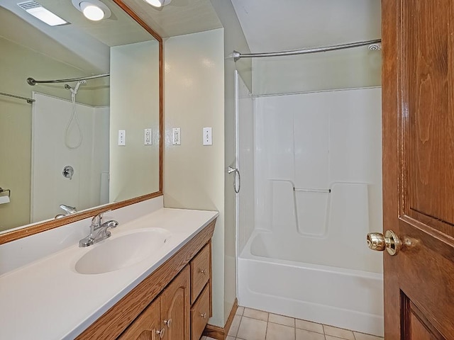 bathroom featuring vanity, tile patterned flooring, and  shower combination