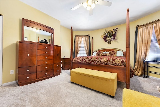 bedroom featuring ceiling fan and light colored carpet