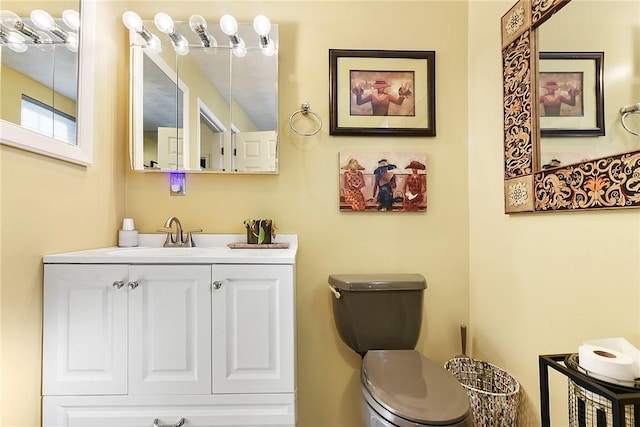 bathroom with toilet and vanity