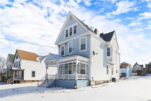 view of front of property featuring central AC unit and a porch