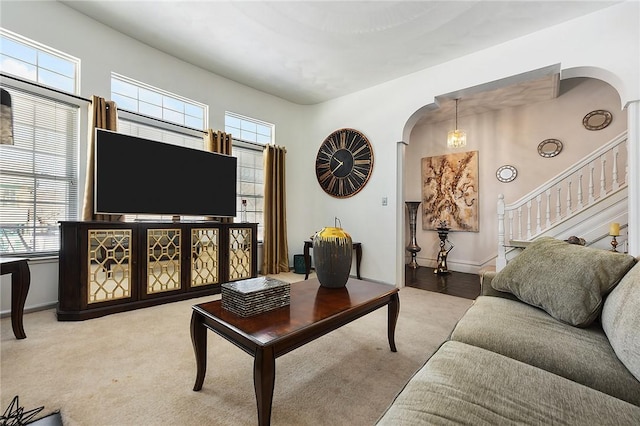 living room featuring light colored carpet and a wealth of natural light