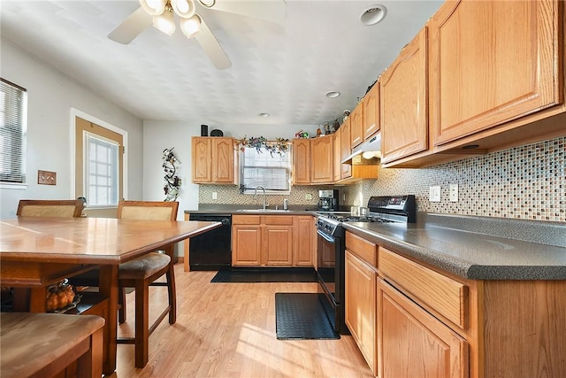 kitchen with black appliances, light hardwood / wood-style floors, sink, backsplash, and ceiling fan