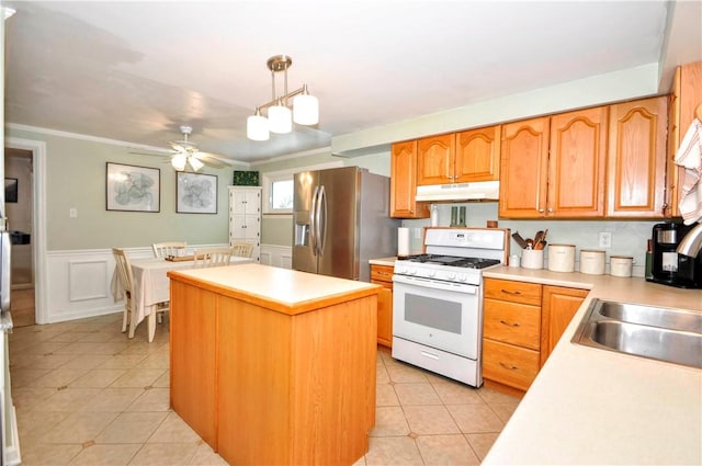 kitchen with a center island, decorative light fixtures, white gas stove, stainless steel fridge with ice dispenser, and ceiling fan