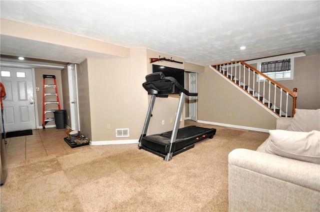 exercise area featuring carpet floors