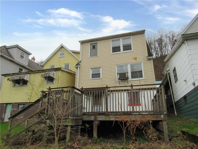 rear view of house with a wooden deck