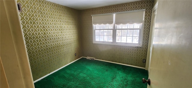 unfurnished room with carpet flooring