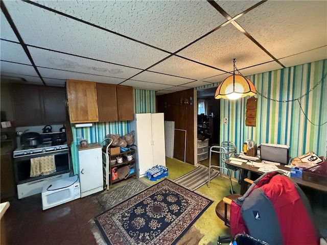 kitchen with a drop ceiling and gas range