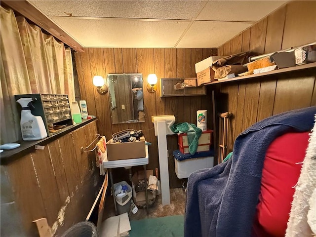 miscellaneous room featuring wooden walls