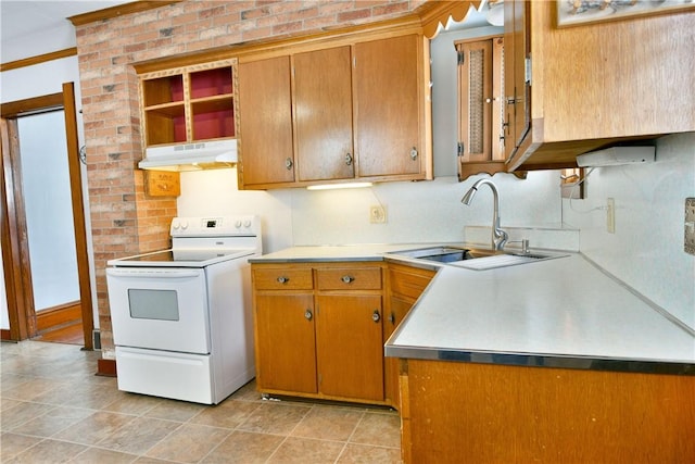 kitchen with brick wall, sink, tasteful backsplash, and electric stove