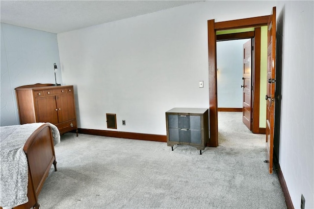 bedroom with light colored carpet