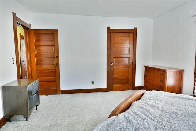 bedroom featuring light carpet