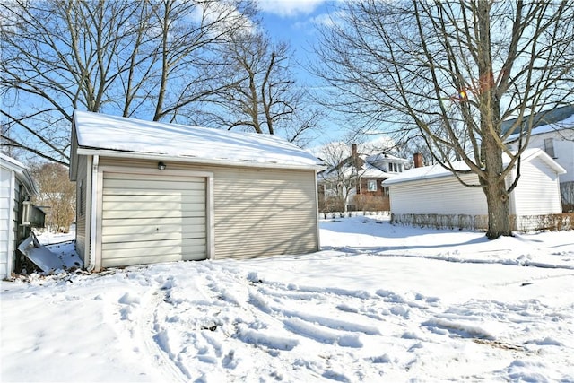 view of snow covered garage