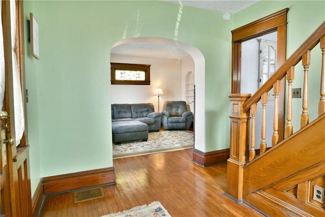 interior space featuring hardwood / wood-style floors and built in features