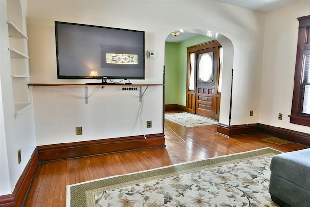 entryway with hardwood / wood-style floors