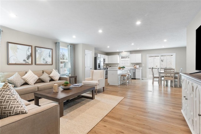 living room with light hardwood / wood-style floors