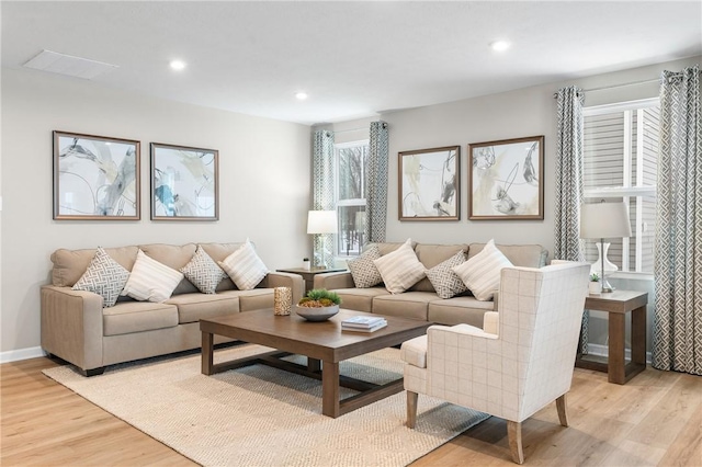 living room featuring light hardwood / wood-style floors and plenty of natural light