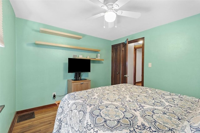 bedroom featuring ceiling fan and hardwood / wood-style flooring