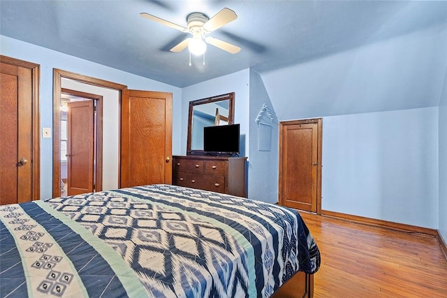 bedroom featuring vaulted ceiling, ceiling fan, and light hardwood / wood-style floors