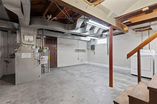 basement with electric panel, independent washer and dryer, and gas water heater