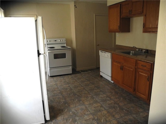 kitchen with sink and white appliances