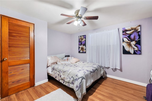 bedroom featuring ceiling fan and hardwood / wood-style floors