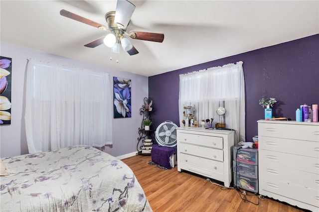 bedroom featuring ceiling fan and light hardwood / wood-style floors