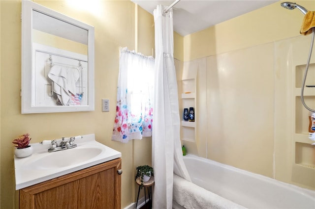 bathroom featuring vanity and shower / bath combination with curtain