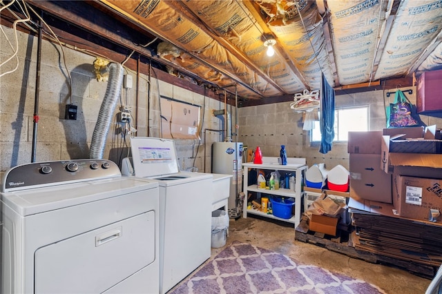 basement with washing machine and dryer and water heater