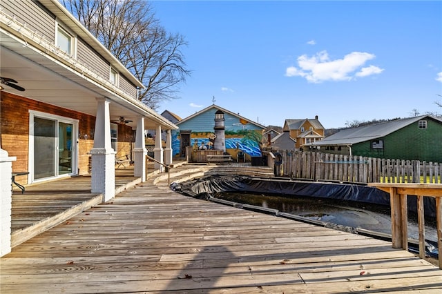 wooden terrace featuring ceiling fan