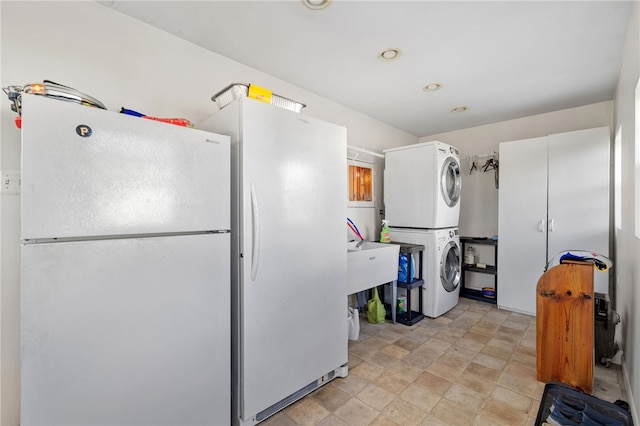 laundry area featuring stacked washer and dryer