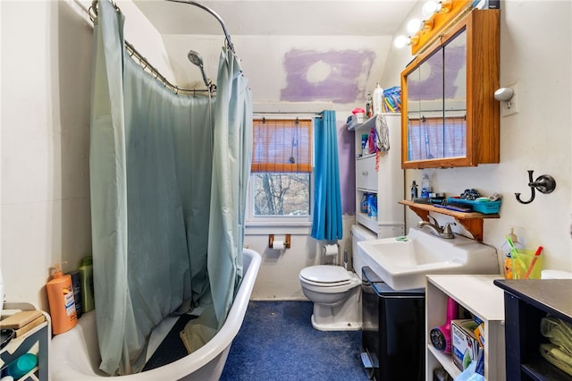 full bathroom featuring toilet, vanity, and shower / bathtub combination with curtain