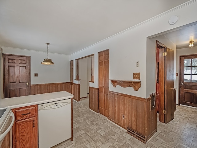 4024 Glen Eden Rd, Cranberry Twp, PA 16066 - kitchen featuring white dishwasher, wainscoting, stainless steel range with electric stovetop, wooden walls, and brown cabinetry