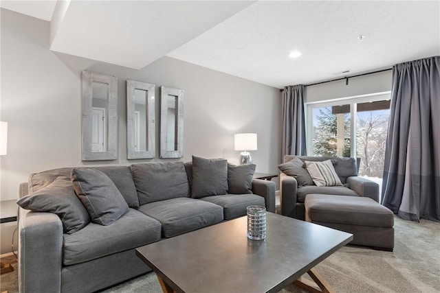 living room featuring light carpet