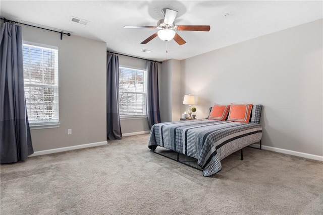 carpeted bedroom featuring ceiling fan