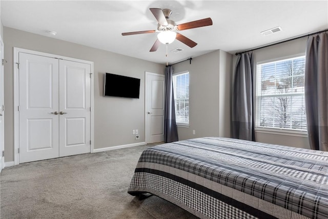 carpeted bedroom with ceiling fan