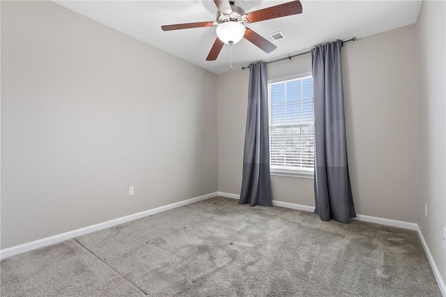 unfurnished room featuring ceiling fan and light colored carpet