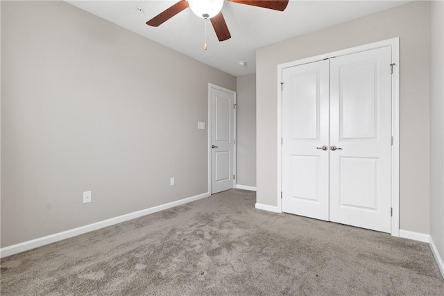 unfurnished bedroom with light carpet, ceiling fan, and a closet