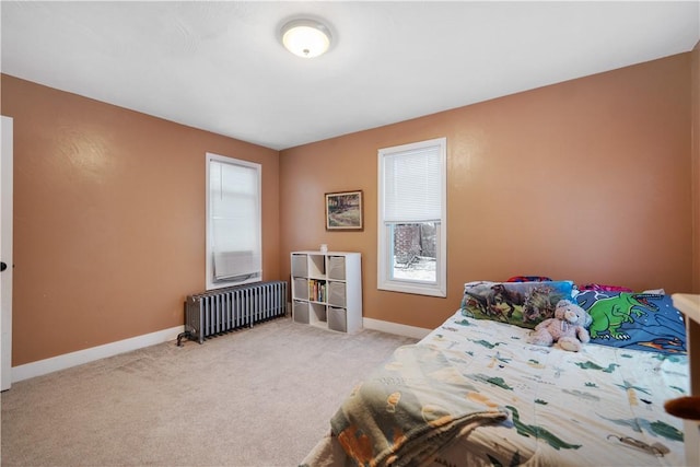 carpeted bedroom featuring radiator