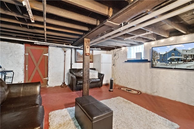 basement featuring white refrigerator