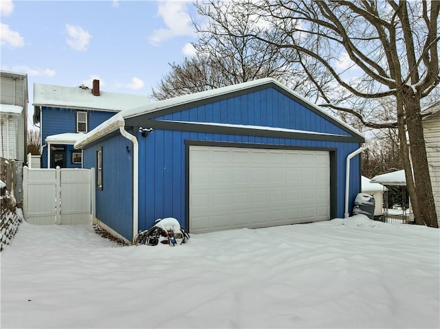 view of snow covered garage