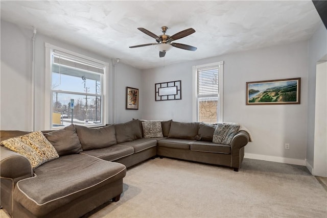 living room featuring light carpet and ceiling fan