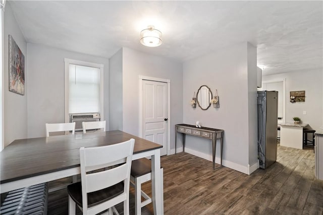 dining room featuring cooling unit and dark hardwood / wood-style flooring