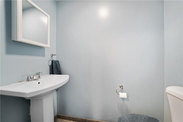 bathroom with toilet and sink