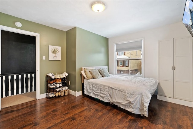 bedroom featuring dark hardwood / wood-style flooring