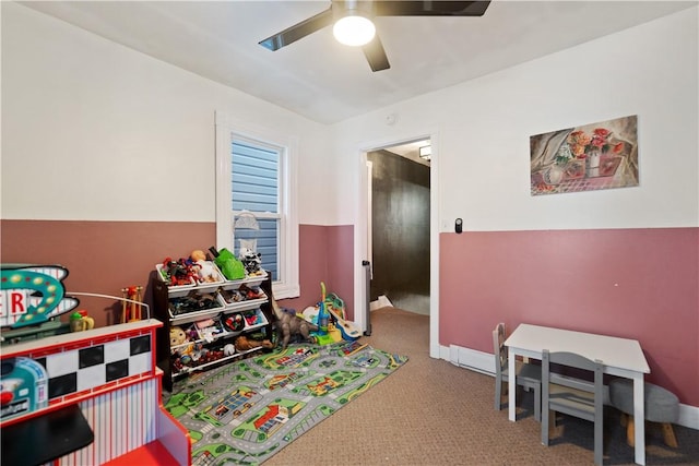 rec room with ceiling fan and carpet floors